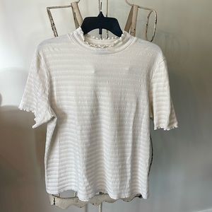Textured mock ruffle neck top